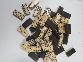 A BOX OF WOOD AND BONE DOMINOES