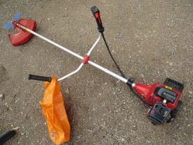 A LARGE PETROL STRIMMER WITH EXTRA ATTACHMENTS