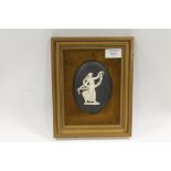 A VINTAGE FRAMED WEDGWOOD BLACK JASPERWARE DANCING HOURS PLAQUE