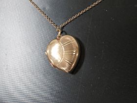 A LOCKET ON CHAIN MARKED 9CT GOLD BACK AND FRONT