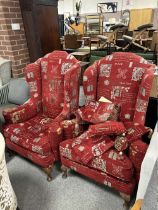 A PAIR OF CLASSICAL UPHOLSTERED WING ARMCHAIRS