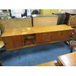 A MID CENTURY TEAK SIDEBOARD WITH SLIDING DOORS - W 213 CM A/F