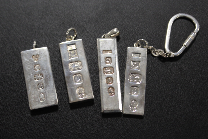 FOUR ASSORTED HALLMARKED SILVER PENDANTS ETC IN THE FORM OF SILVER INGOTS (APPROX OVERALL WEIGHT 112