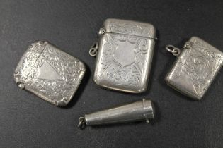 A SILVER CHEROOT HOLDER TOGETHER WITH THREE HALLMARKED SILVER VESTA CASES (4)