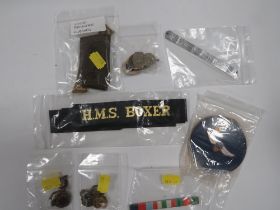 A QUANTITY OF MILITARY COLLECTABLE'S TO INCLUDE A SHOULDER FLASHES, PIN BADGES ETC