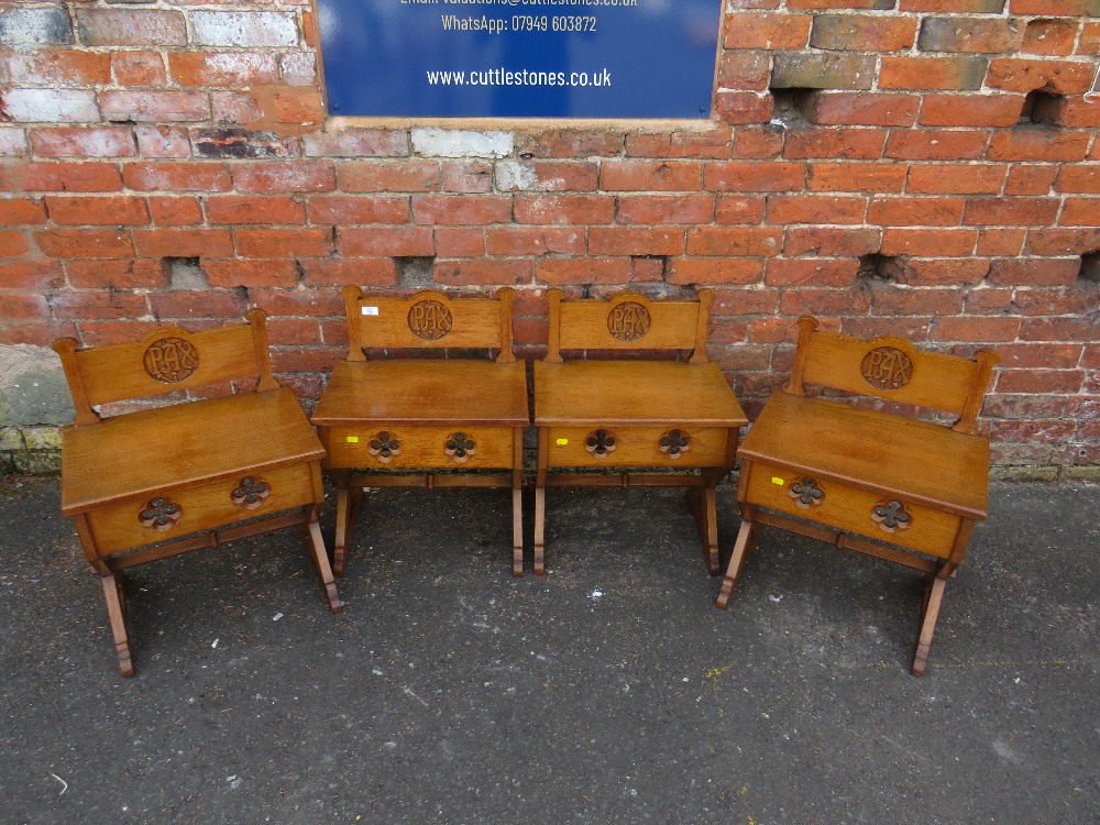 A SET OF FOUR ECCLESIASTICAL OAK CARVED CHURCH STOOLS - 'ST MARYS ABBEY'