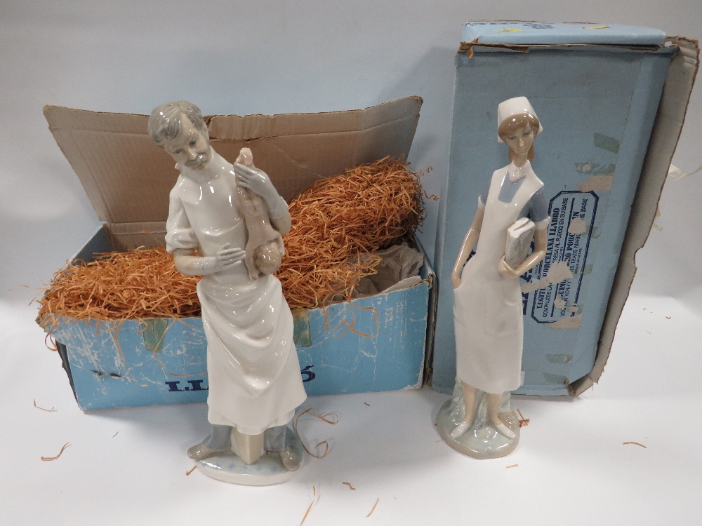 A LLADRO FIGURE OF A DOCTOR HOLDING A NEW BORN BABY TOGETHER WITH A LLADRO FIGURE OF A NURSE IN