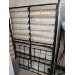 A MODERN METAL DOUBLE BED FRAME WITH MATTRESS