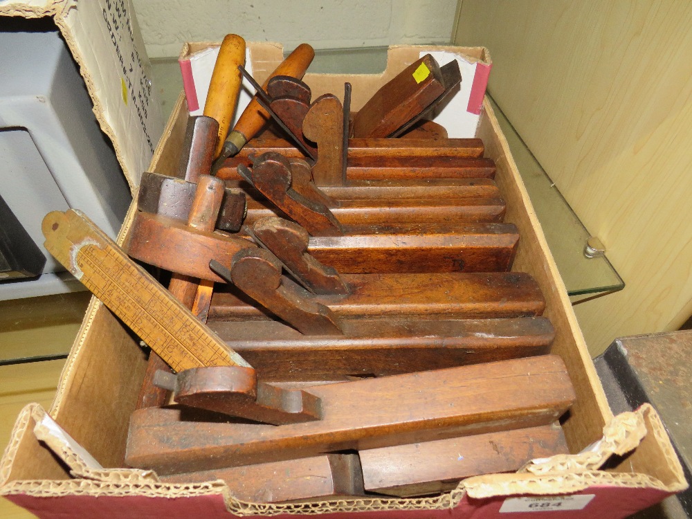 A TRAY OF VINTAGE WOODEN REBATE PLANES , CHISELS AND MEASURING GAUGES