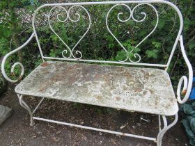 A TWO SEATER WROUGHT IRON GARDEN BENCH