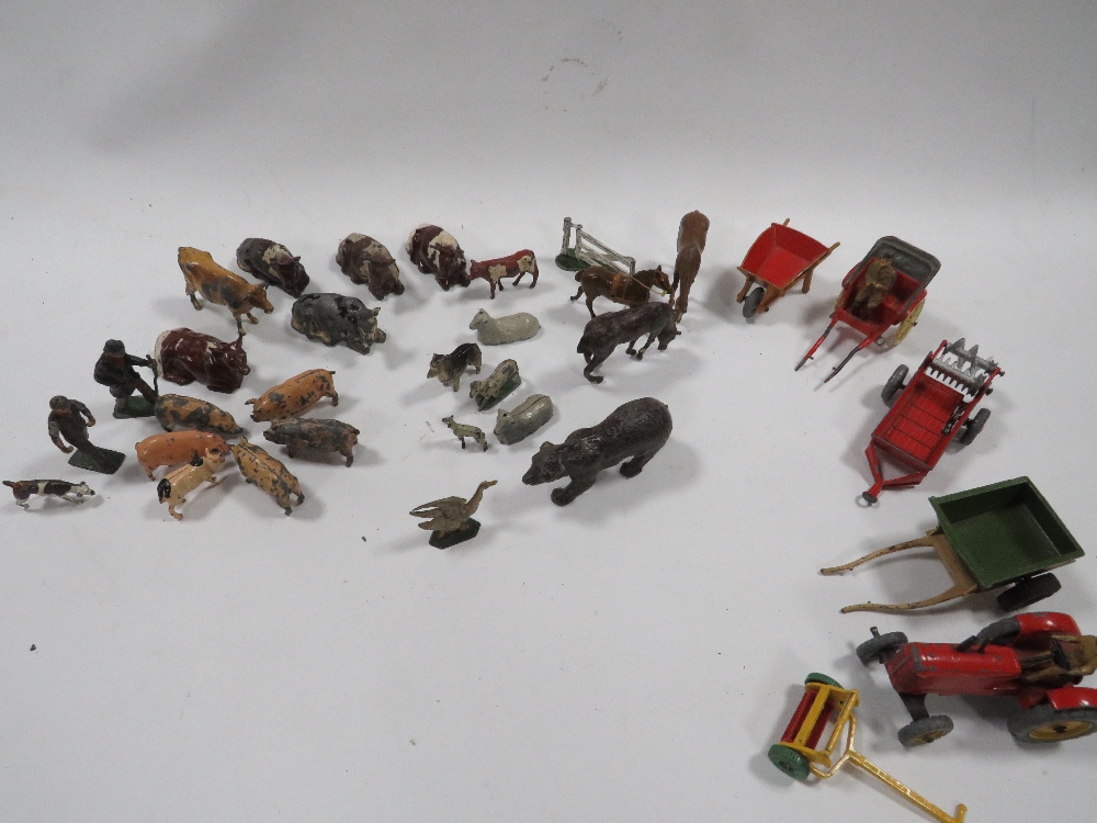 A BOX CONTAINING VINTAGE METAL FARM ANIMALS ETC