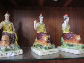 THREE REPRODUCTION STAFFORDSHIRE STYLE FIGURES OF BRITANNIA