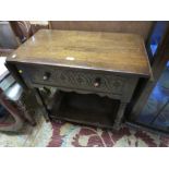 A CARVED OAK SINGLE DRAWER DROPLEAF HALL TABLE W-123 CM