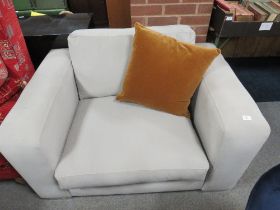 A LARGE MODERN SQUARE UPHOLSTERED ARMCHAIR
