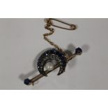 A YELLOW METAL VICTORIAN CRESCENT SHAPED BROOCH SET WITH SAPPHIRES, DIAMONDS AND CENTRAL PEARL