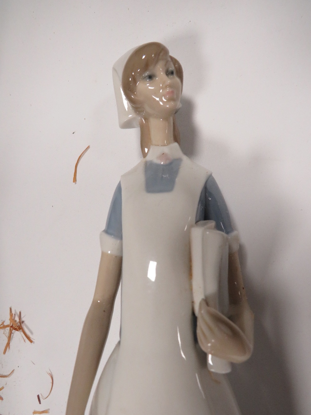 A LLADRO FIGURE OF A DOCTOR HOLDING A NEW BORN BABY TOGETHER WITH A LLADRO FIGURE OF A NURSE IN - Image 6 of 6