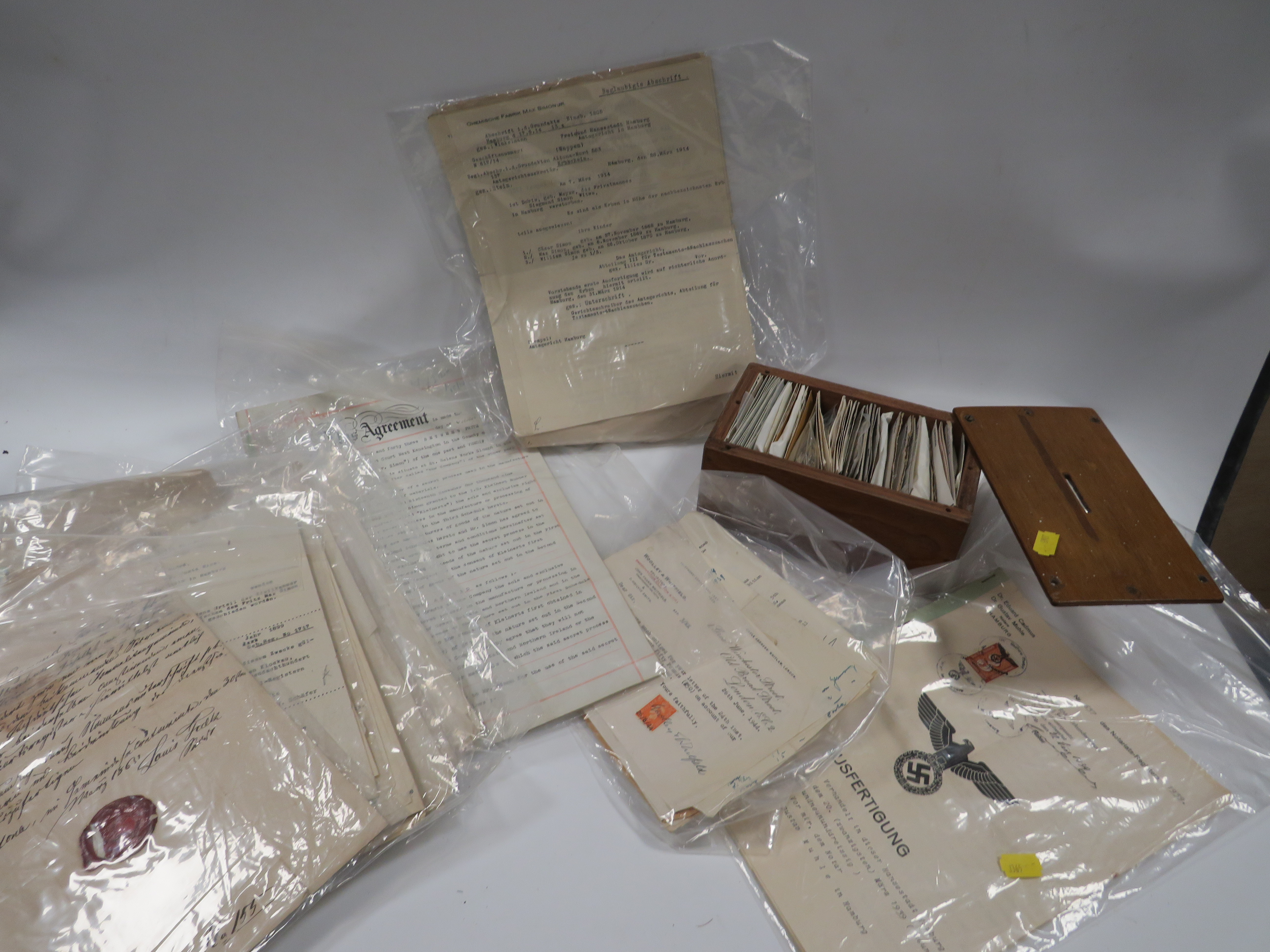 A BOX CONTAINING STAMPS, PAPERWORK AND DOCUMENTS TO INCLUDE GERMAN MILITARY EXAMPLES