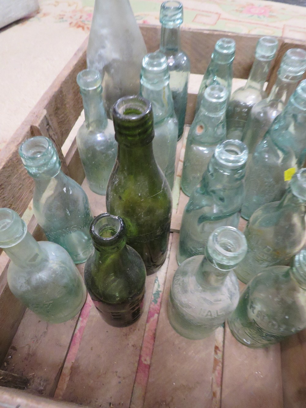 A CRATE OF VINTAGE BOTTLES