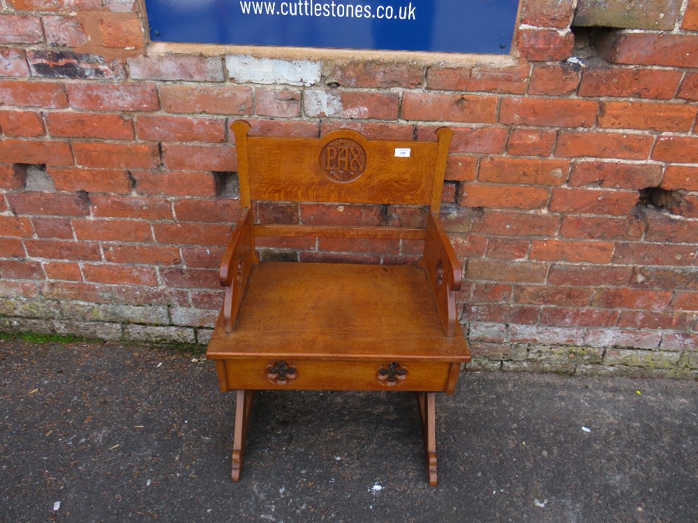 A CARVED OAK ECCLESIASTICAL CHURCH LOW ARMCHAIR - 'ST MARYS ABBEY'