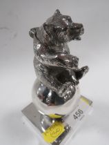 A CHROMED METAL INKWELL IN THE SHAPE OF A BEAR
