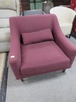 A MODERN MAROON ARMCHAIR