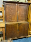 An antique oak school type cupboard with two door, cupboard above and below H 175 cm W 119 cm