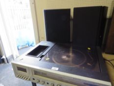A Waltham STM-50 stereo/radio record player, cassette deck (untested) complete with a pair of