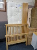A modern wooden single bed frame with Myers mattress