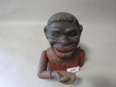 A vintage articulated money bank