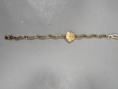 An Accurist .375 wrist watch on yellow metal bracelet