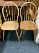 A pair of Eco style stick back chairs A/F together with a pair of prints
