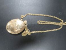 A hallmarked 9 carat gold locket on a 9k chain approx. weight 17.5g
