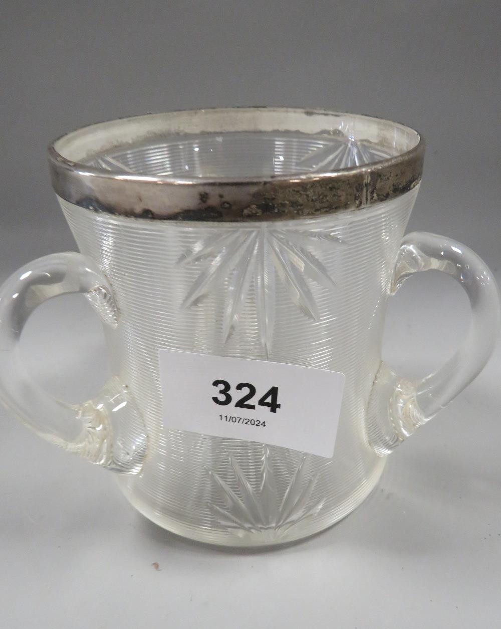 A hallmarked silver rimmed glass tig table striker