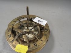 A reproduction brass compass