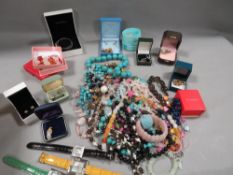 A box of assorted costume jewellery, watches etc