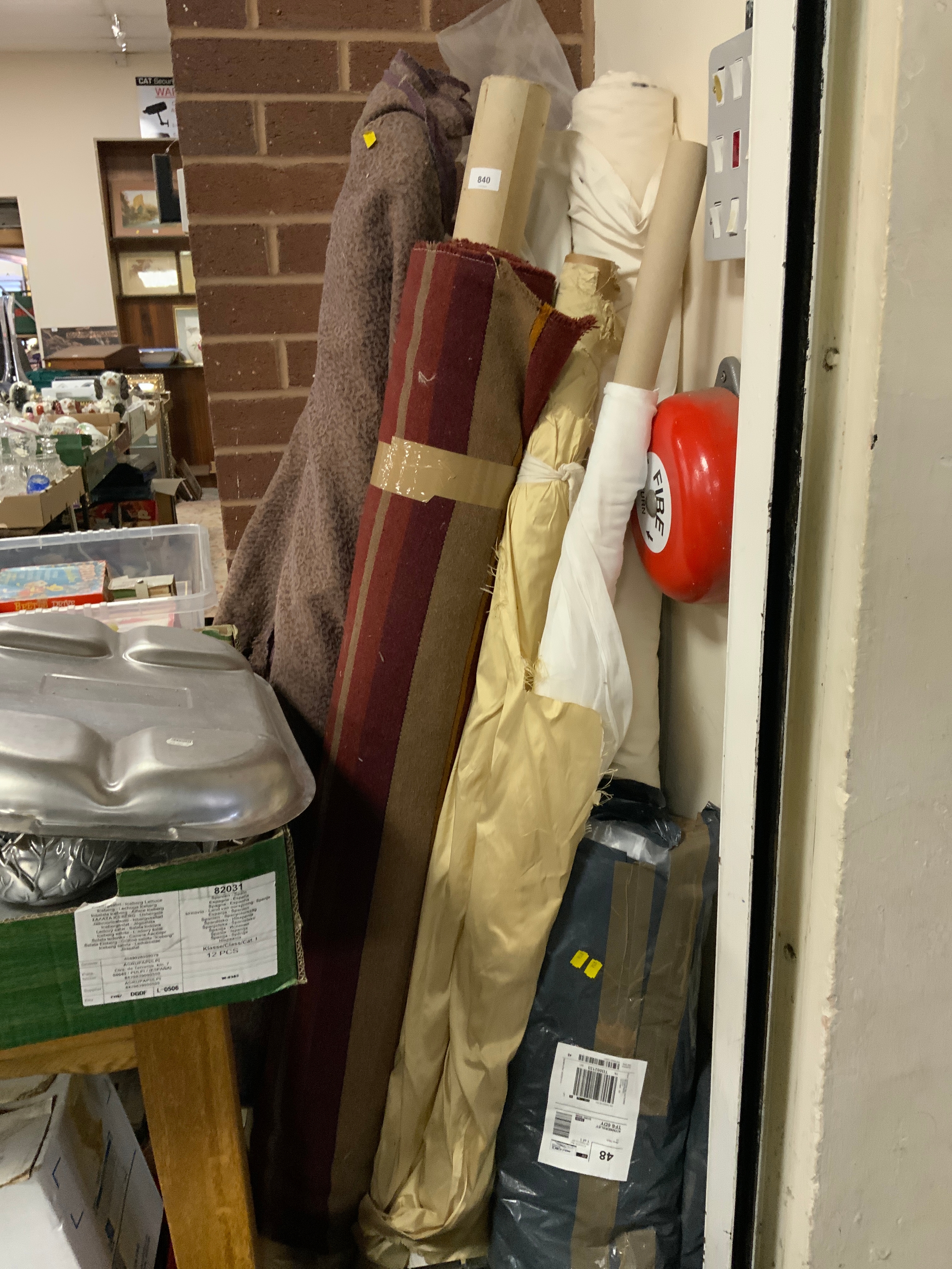 A quantity of assorted fabric on rolls