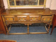 A quality oak reproduction Jacobean style dresser with three drawers W 149 cm