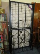 A modern metal single bed frame with a mattress