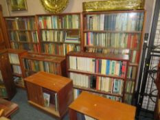 A large quantity of mid-century rosewood and other bookcases to also include a huge quantity of