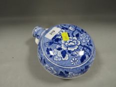 An antique blue/white moon flask