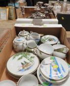 A tray of metal ware to include candelabra together with a tray of oriental style tea ware