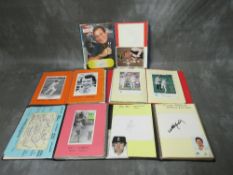 FOUR ALBUMS CONTAINING PICTURES, CARDS, CUTTINGS SIGNED BY CRICKETERS, to include Gary Sobers,