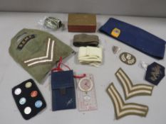 A Military paperweight, badges etc