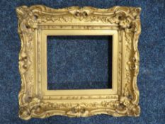 A 19TH CENTURY GOLD SWEPT FRAME WITH GOLD SLIP, frame W 5.5 cm, slip rebate 16.5 x 14 cm, frame