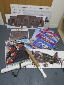 A selection of military posters to include a helicopter cockpit training board, various aircraft