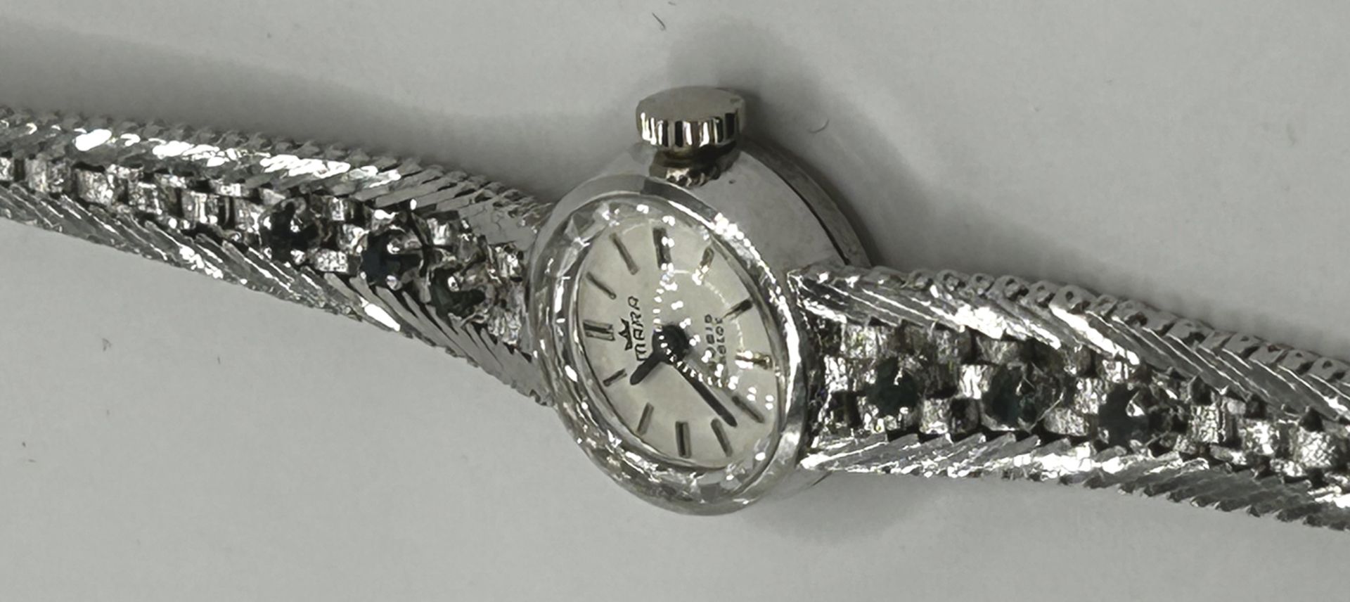 mechan DAU "Amara" Silber-835-, Armband ebenso, mit 6 Saphiren, Werk läuft, zus. 22 gr, L-Band 17 c