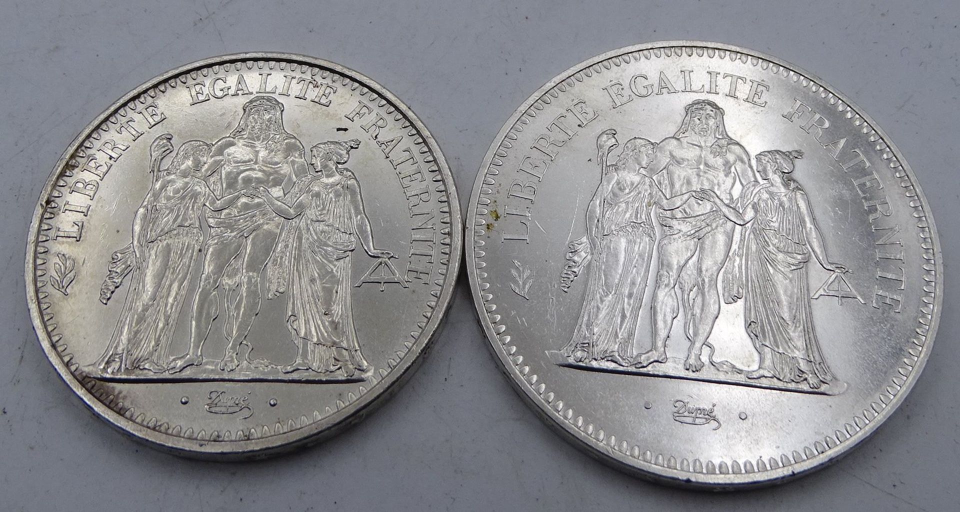 2x Silber-Münzen, Frankreich, 50 Franc 1974, 10 Franc 1965, zus. 54,7 gr.