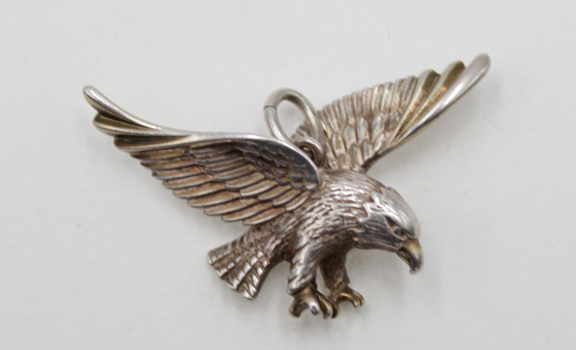 figürl. Anhänger, Adler, Silber (gepr.), ca. 5,3gr., 2,5 x 3,8cm.