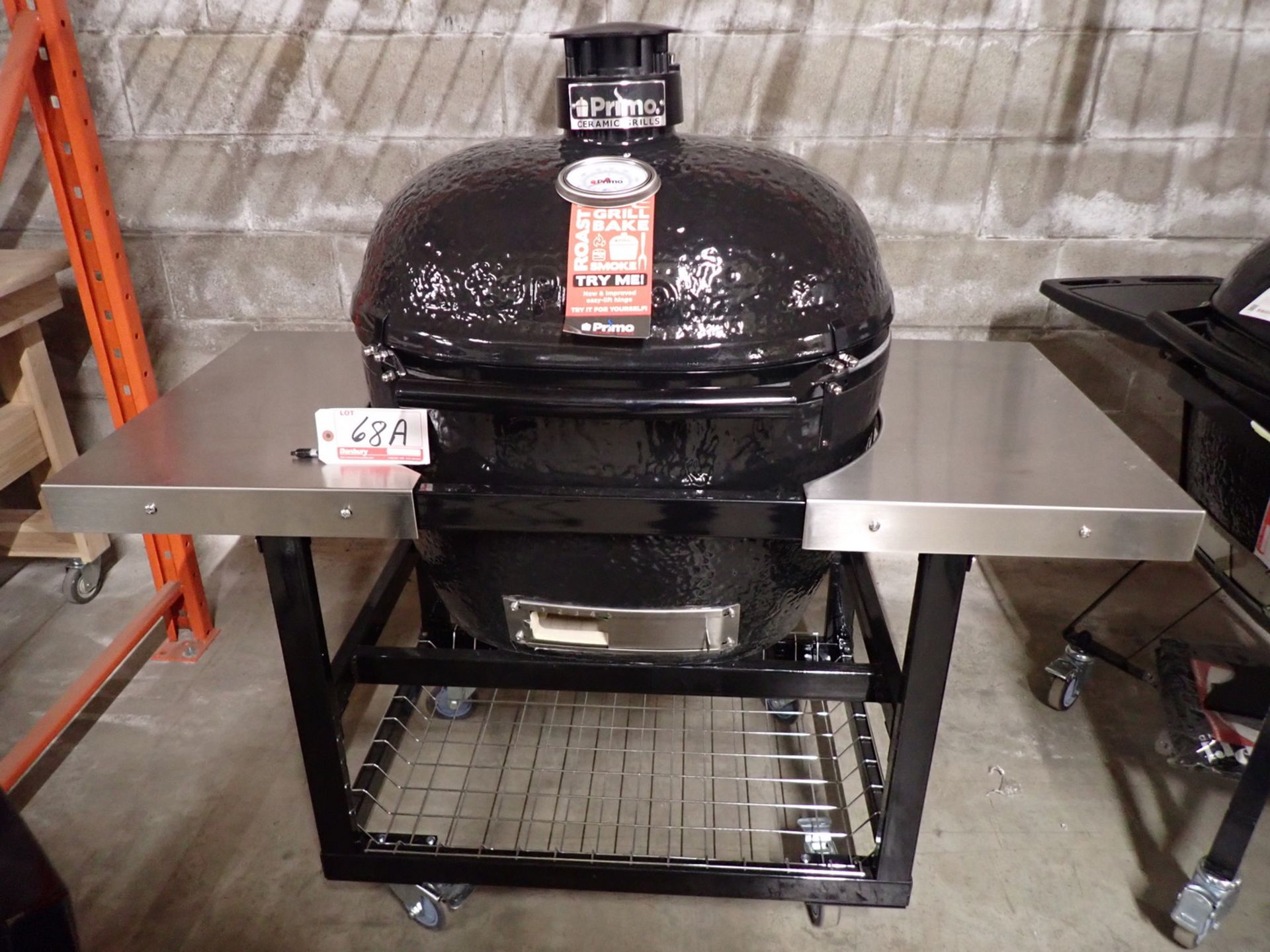 PRIMO PGCXLH OVAL X-LARGE CERAMIC EGG CHARCOAL GRILL & SMOKER C/W S/S TOP & PORTABLE TABLE (MSRP $