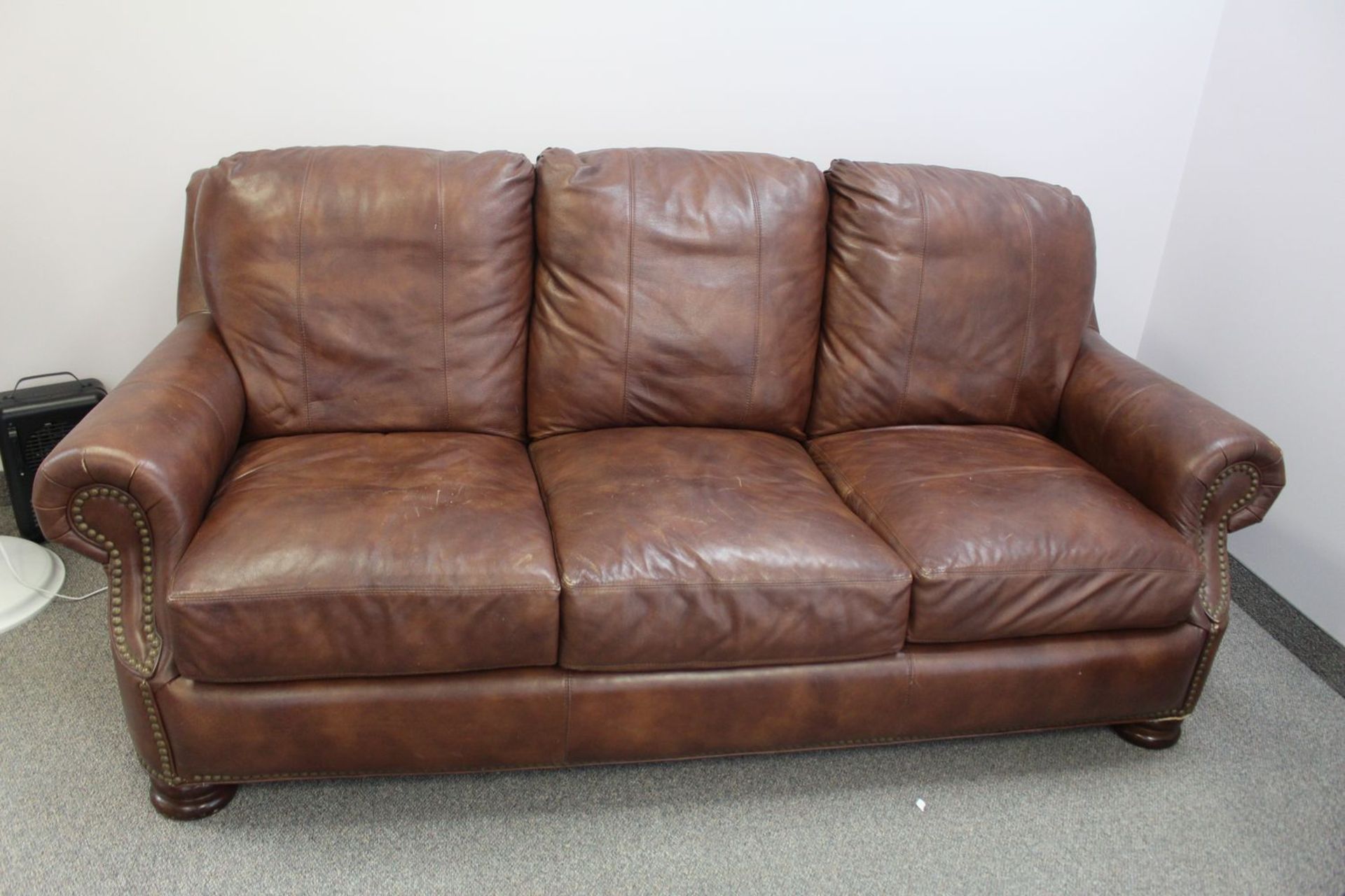 BROWN LEATHER 3-SEAT SOFA W/ STUDS - 88"L X 45"D X 36"H (LOCATED AT: NIAGARA ON-THE-LAKE, ONTARIO